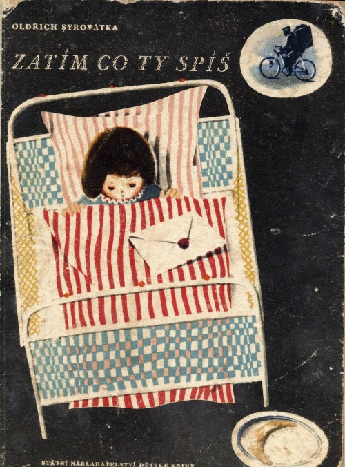 Little child in iron bed with letter